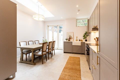 Baverstock Buff limestone-effect porcelain tiles in a light kitchen