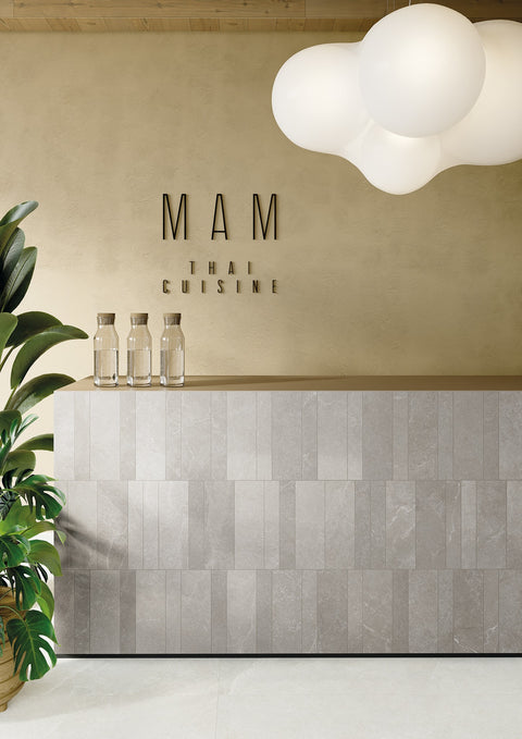 Milan Duomo and Navigli porcelain tiles used across a layered interior