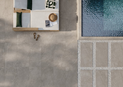 Milan Sforza warm grey porcelain paving beside a pool